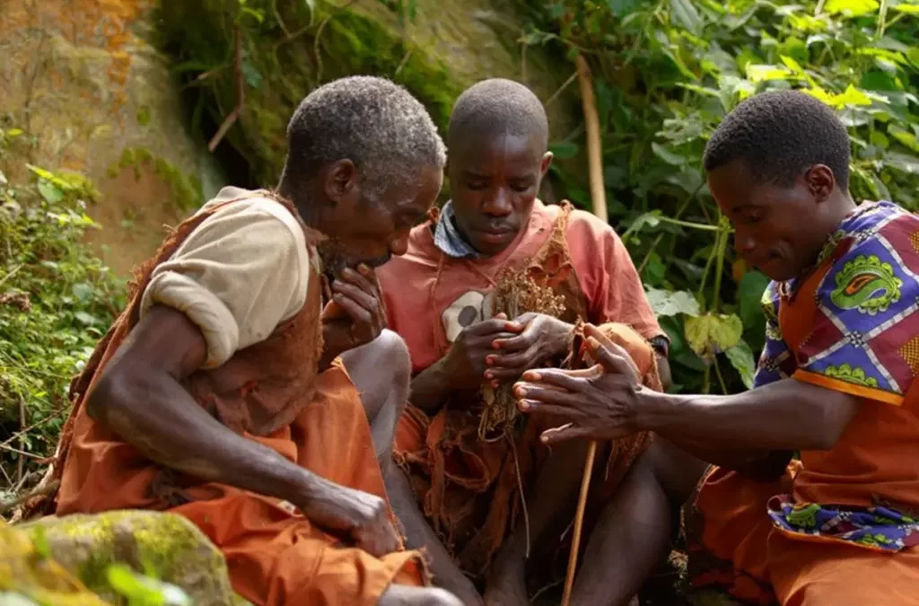 Batwa community members demonstrating traditional fire-making